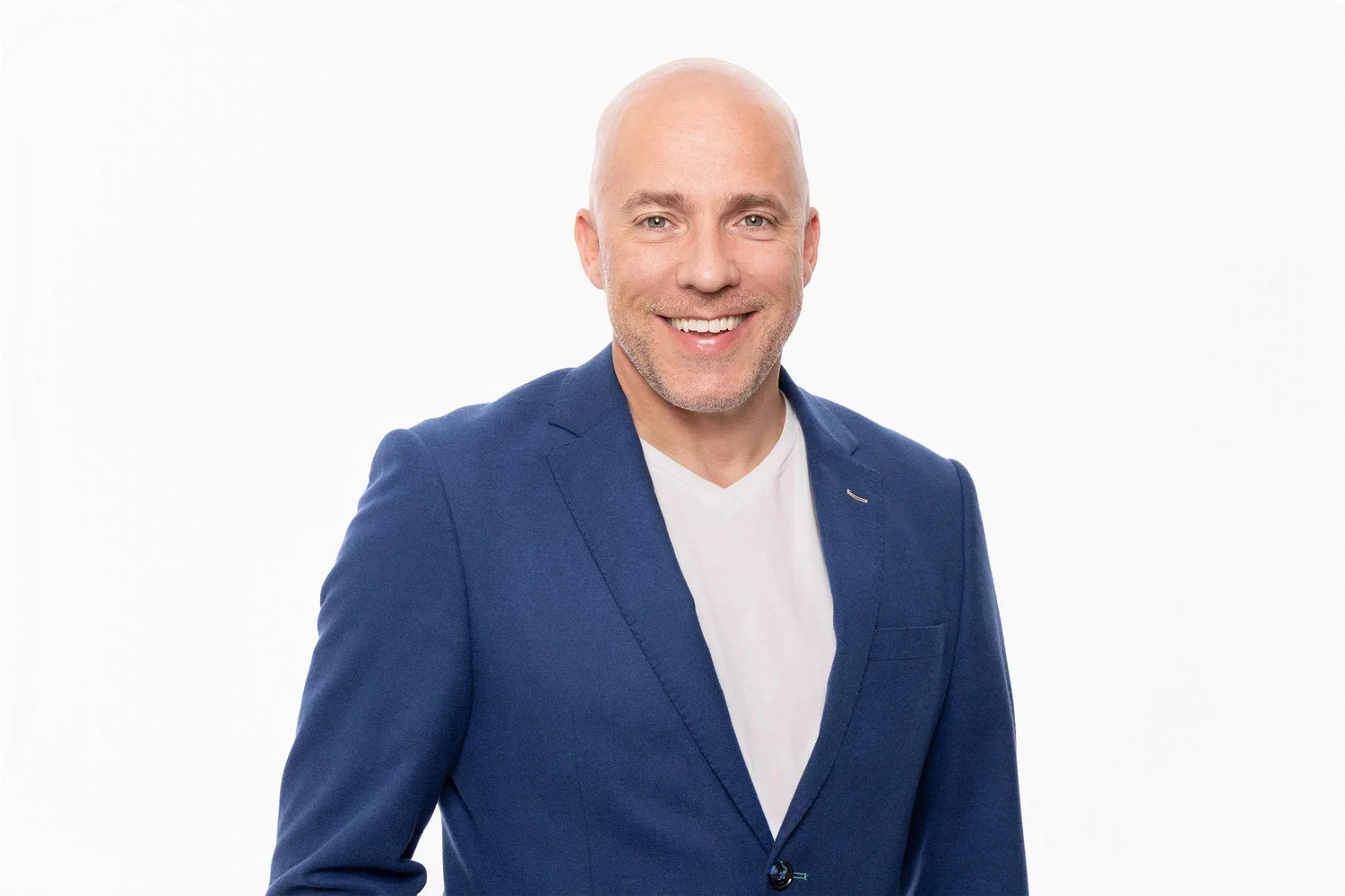 Headshot photography of a man in a blue jacket